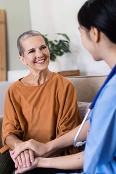 nursing and elder woman with insurance for home and support with a smile on a couch.