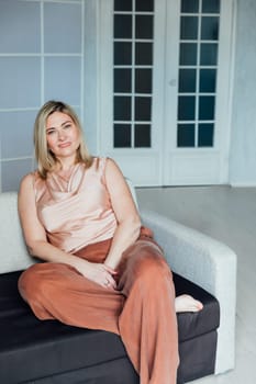 caucasian lady sit down on the sofa