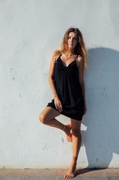 Beautiful woman in black summer dress
