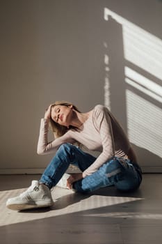 Blonde woman in stylish streetwear casual