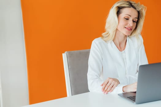 Business Woman Secretary Working Online Remotely With Laptop Computer In Office