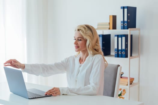Business Woman Secretary Working Online Remotely With Laptop Computer In Office
