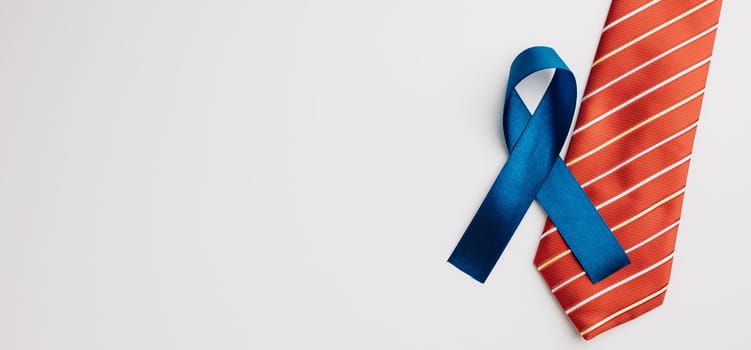 In November and September, a blue ribbon takes the spotlight, symbolizing prostate cancer and men's health awareness on a white background.