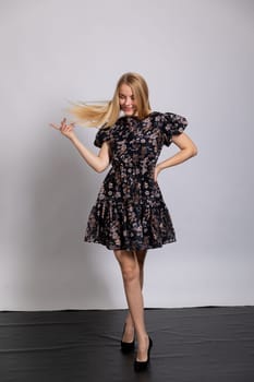 beautiful blonde dancing on white background