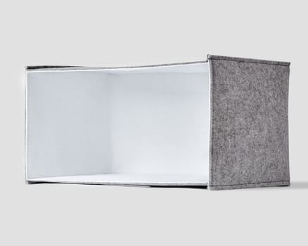 Stylish handmade gray felt box with white interior lining and handles for organizing home space and storing things