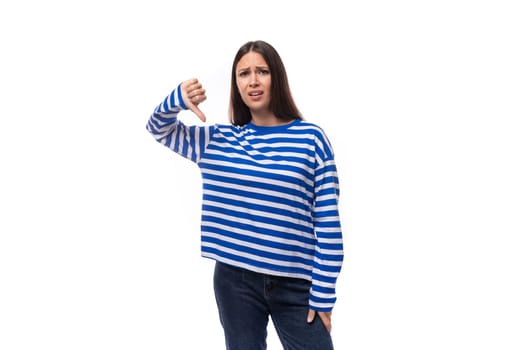 young stylish brunette lady in a striped blue turtleneck on a white background with copy space. people lifestyle concept.