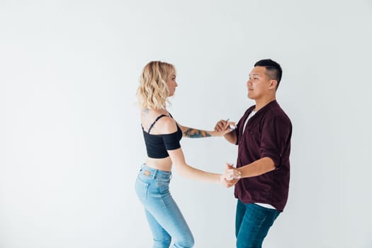 a man and a woman dance bachata latin casombu salta in the studio hall