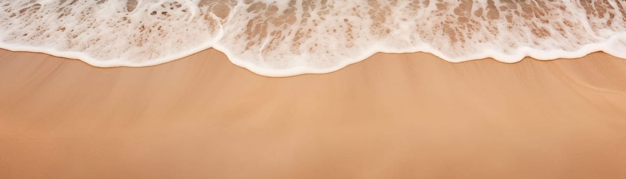 Aerial view of a beach with foamy wave washing over golden sand. Vacation background. Tranquility and relaxation by ocean. Peaceful holiday. Relax in the nature. Meditation. Copy space. Generative AI