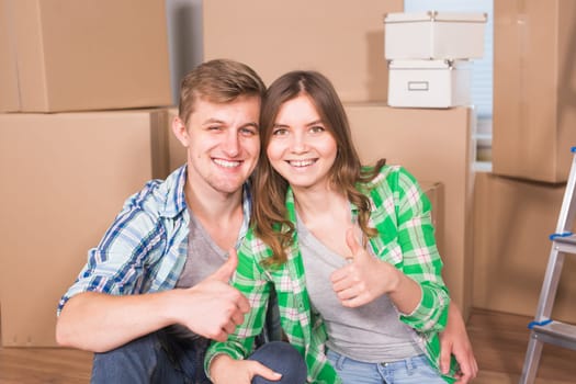 Home, people, moving and real estate concept - Portrait of happy couple in new home.