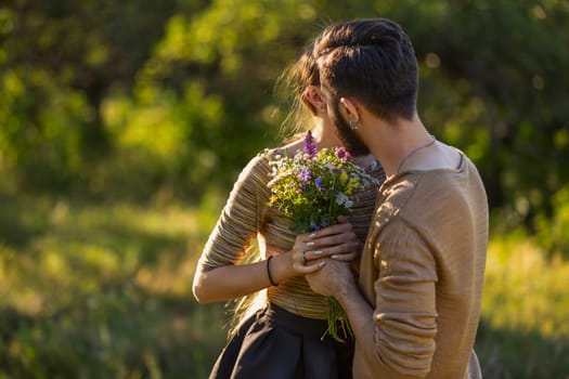 guy gives his girlfriend wild flowers