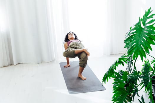 a leg stretching exercises yoga trainer gymnastics acrobatics woman