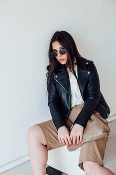 a fashionable fashion woman posing sitting