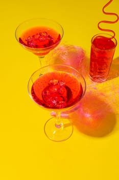 Pink summer cocktails on color background close up photo