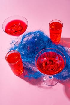 Pink summer cocktails on color background close up photo