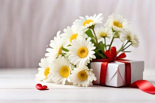 A bouquet of white daisies in a gift box with red satin ribbons and red hearts on a light background