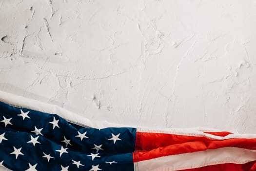 A vintage American flag for Veteran's Day, symbolizing honor, pride, and unity in the USA. Patriotic stars and stripes reflect government's significance. isolated on cement background