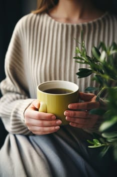 unrecognizable beautiful young woman relaxing over a cup of tea. AI Generated