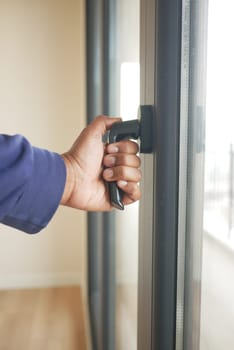 hand open gray plastic pvc window at home