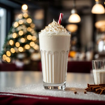 image of a beautiful glass with a white milkshake on the Christmas table