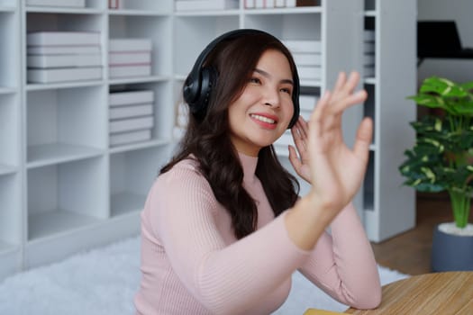 Woman relaxing wearing headphones listening to music in her house