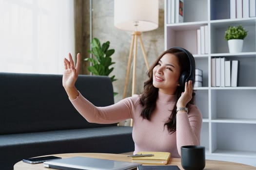 Woman relaxing wearing headphones listening to music in her house