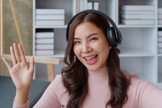 Woman relaxing wearing headphones listening to music in her house