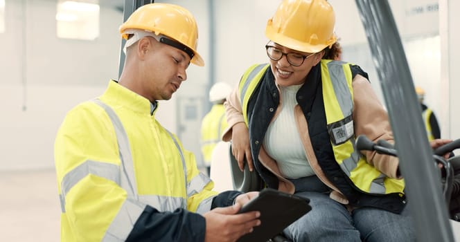 Engineer woman, man and forklift on tablet for logistics, supply chain or ideas on app in warehouse. Employees, helmet and reflective gear for safety at shipping workshop, analysis and transportation.