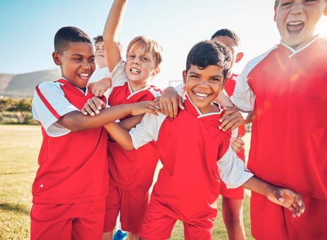 Winner, fitness or happy football children for success, goal or celebration for team building on soccer field. Friends kids or sports children for victory, teamwork or motivation exercise workout.