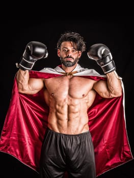 A man with a cape and boxing gloves on