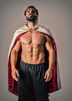 A man with a beard wearing a cape