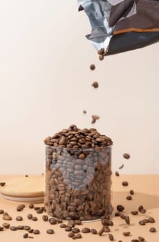 Reusing Glass Jars To Store Dried Food Living Sustainable Lifestyle At Home, copy space. coffee beans pouring to glass jar