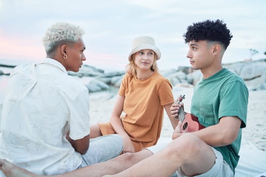 Guitar, beach and friends on holiday at the sea in Spain with music from a musician for peace and calm in nature. People listening to sound from playing ukulele during vacation for travel by ocean.