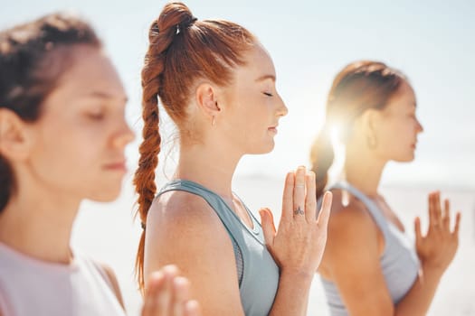 Yoga, meditation and prayer hands with spiritual friends training for zen, fitness and wellness. Peace, motivation and community with young women and pilates, worship and energy exercise.