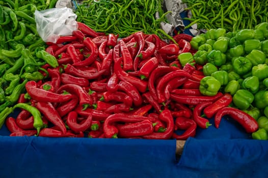 Pepper sale in the traditional farm Turkish market, a counter filled with fresh fruits