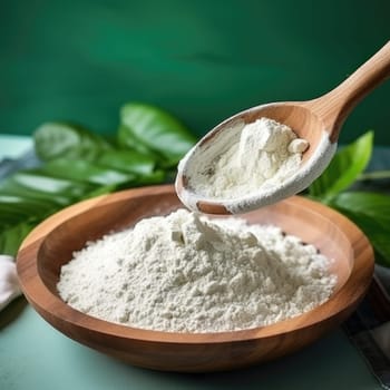 Collagen powder in wooden bowl with spoon on natural green background. AI Generated