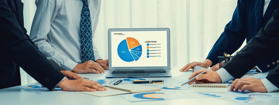 Business people in group meeting in formal attire share idea discussing report for company profit in creative workspace for start up business shot in close up view on group meeting table . Oratory .