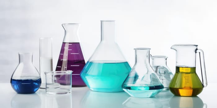 Laboratory equipment beakers and flasks with colorful liquids with backlight in different group. AI Generated