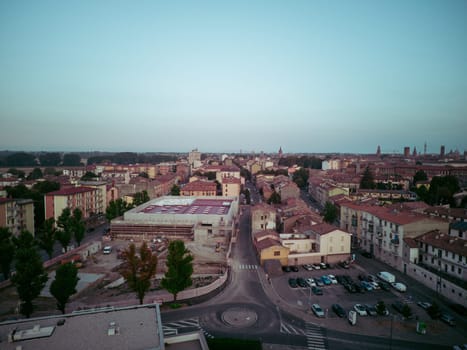 aerial view drone shot of grocery supermarket construction site in Cremona, Italy