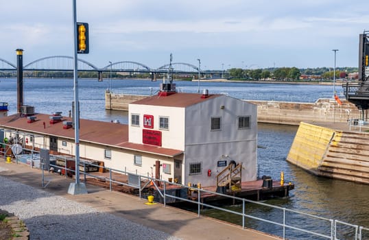 Army Corps of Engineers barge with offices enters Lock and Dam No. 15 in Davenport, Iowa