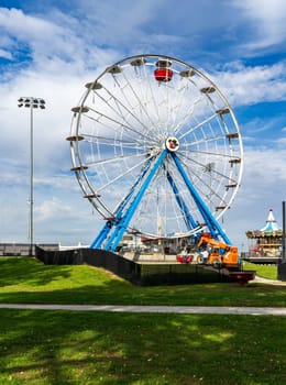 Davenport, IA - 18 October 2023: Dismantling large ferris wheel in amusement park for winter