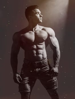Muscles in Motion: Captivating Image of an Attractive, Shirtless Male Bodybuilder. A shirtless man posing for a picture