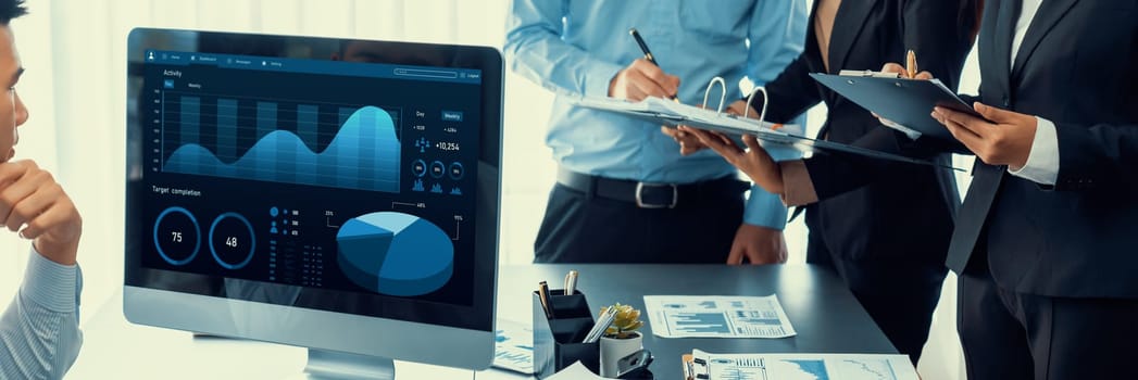 Business intelligence and data analysis concept. Analyst team working on financial data analysis dashboard on laptop screen as marketing indication for effective business strategic planning. Insight