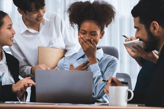 Happy diverse business people work together, discussing in corporate office. Professional and diversity teamwork discuss business plan on desk with laptop. Modern multicultural office worker. Concord