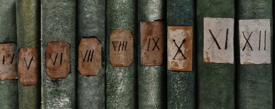 Old books with Roman numerals in the library archive