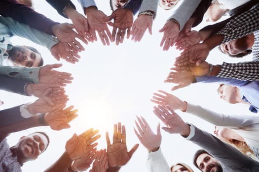 People holding hands together, view from below. Group therapy