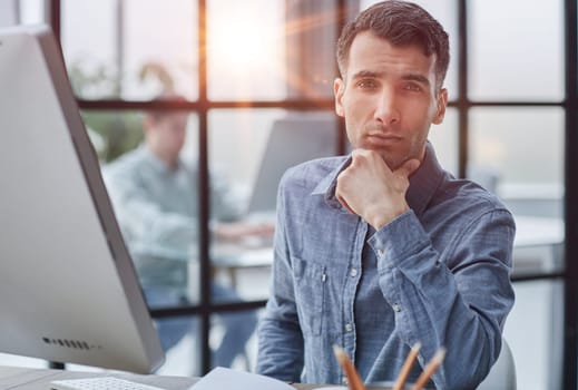 thoughtful male employee pondering considering idea