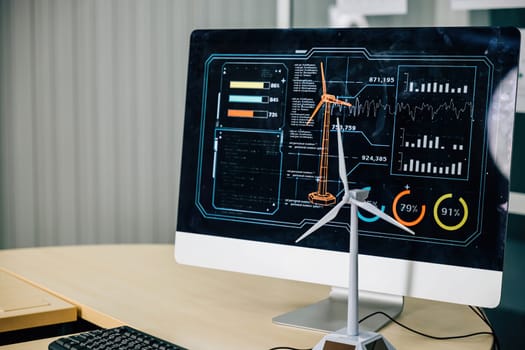 Business professionals, engineer, and architect collaborate on wind turbine development in a stylish office. The computer monitor displays their project's blueprint.