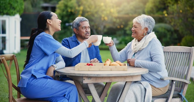 Nurse, tea or people cheers in elderly care, retirement or healthcare support at park or nature. Caregiver, senior man or old woman with coffee toast, meal or outdoor snack together for wellness.