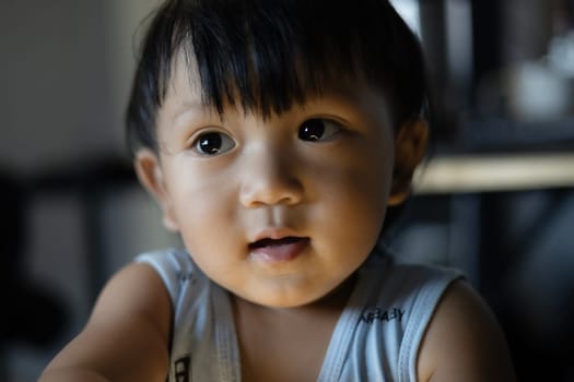 Little Boy Looking Up And Thinking. Close Up Portrait Of Child. Child With Thinking Casually.