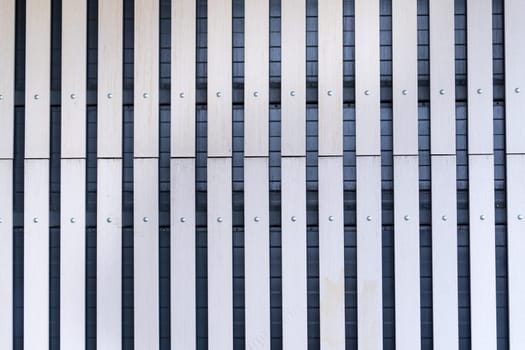 Fence texture of straight lines, metal wall in the city, textured background